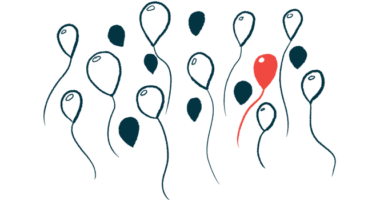 A single red balloon stands out in a group of black and white ones.