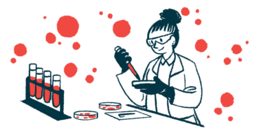 A scientist works in the lab with test tubes and dishes.