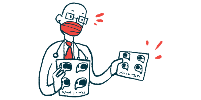 A medical professional is wearing a face mask and holding up two charts.